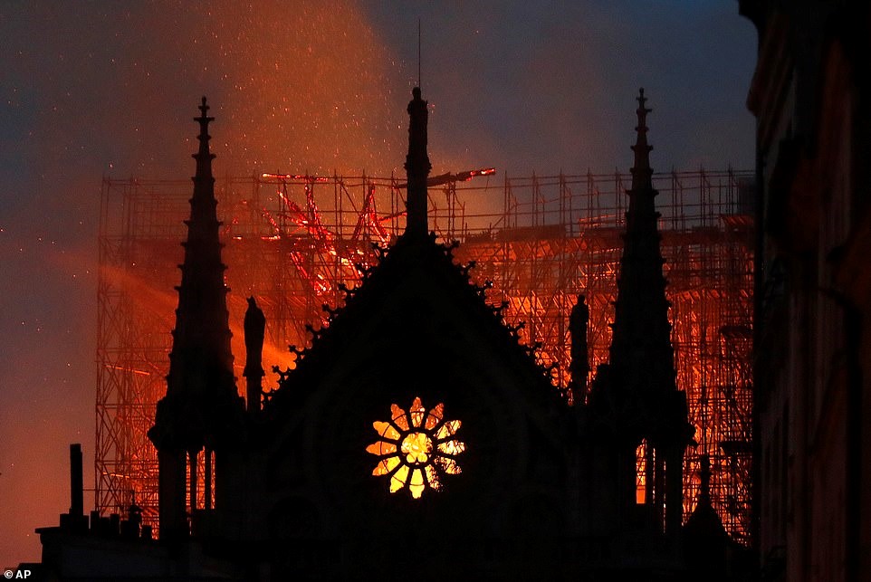 notre dame rose window on fire.jpg