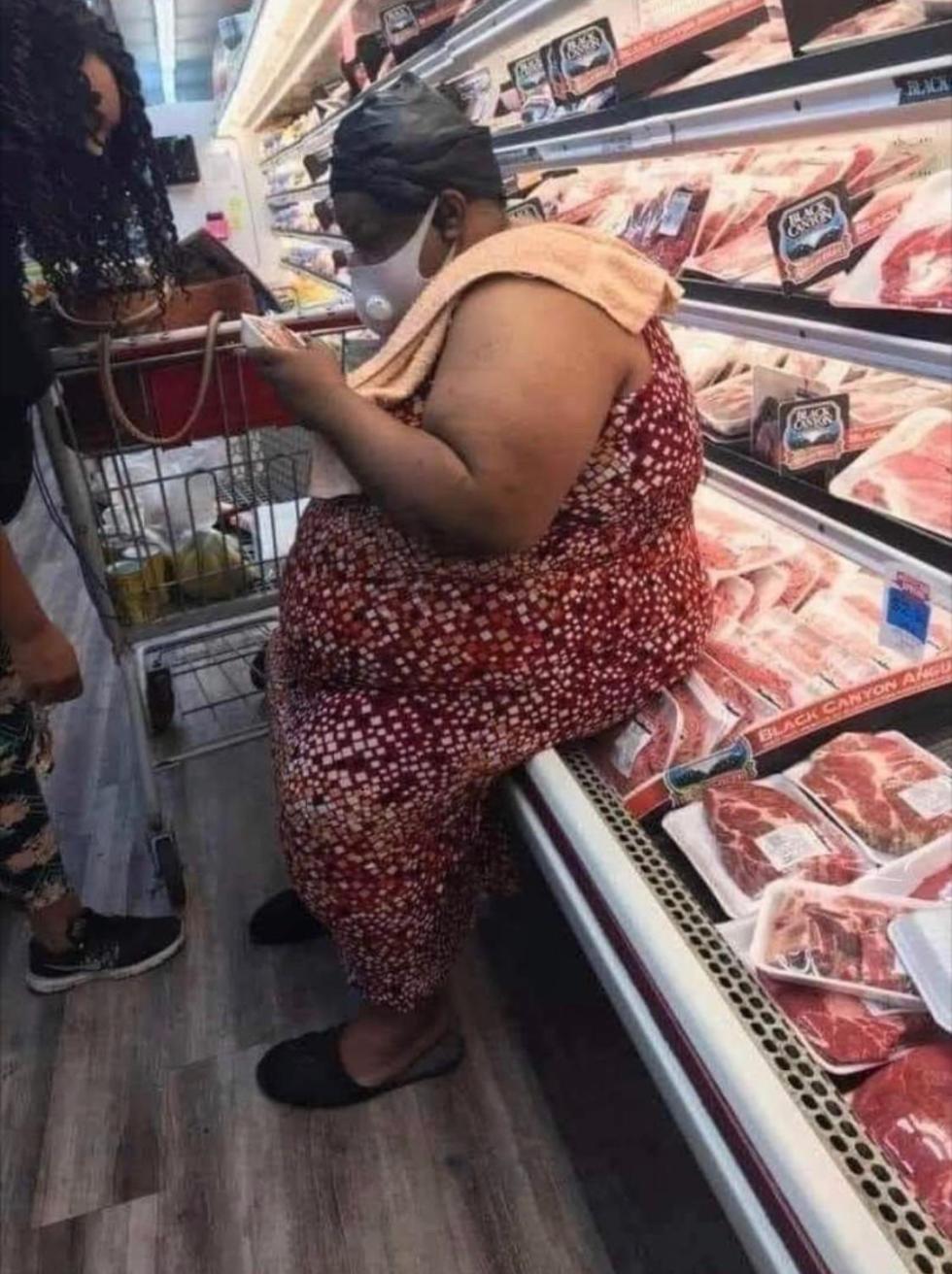 woman sitting on meat