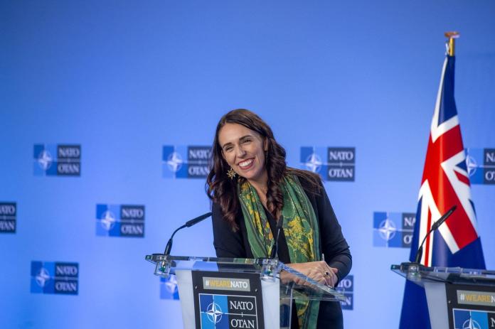 A person standing at a podium Description automatically generated