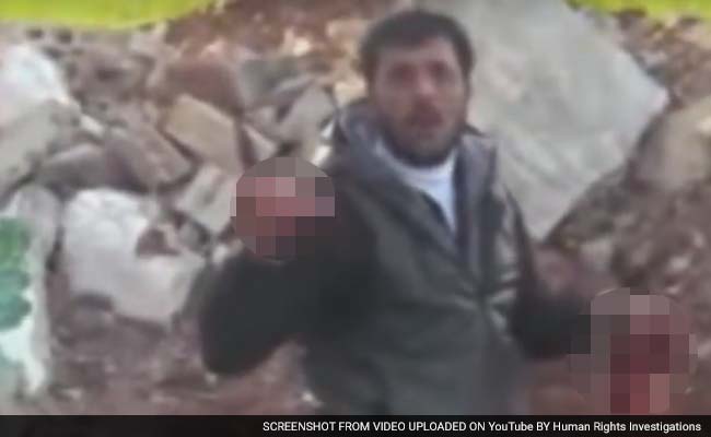 Syrian rebel eating heart Abu Sakkar