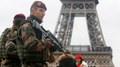 French soldiers at the Eiffel Tower after the Paris shootings. Photo: Reuters