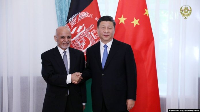 FILE: Afghan President Ashraf Ghani with his Chinese counterpart Xi Jinping in Kyrgyzstan in June 2019.